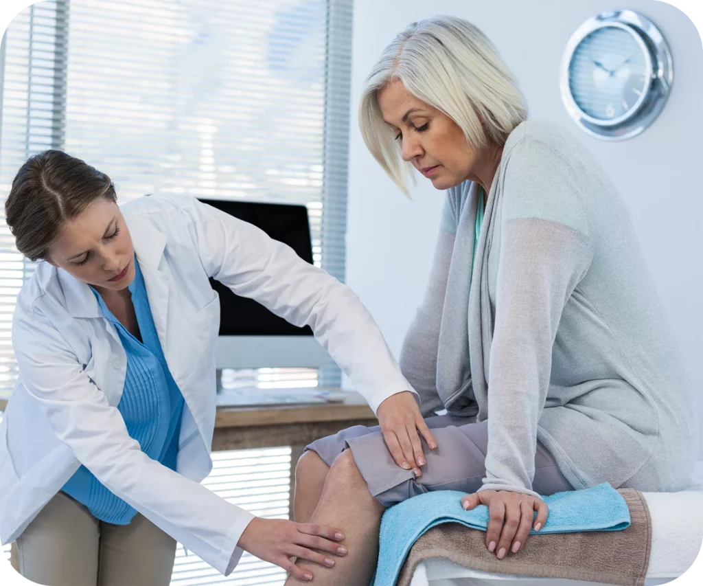 a woman with knee osteoarthritis during a consultation with her doctor.